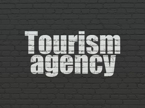 Vacation concept: Painted white text Tourism Agency on Black Brick wall background