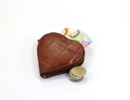 Heart-shaped wallet with notes and coins