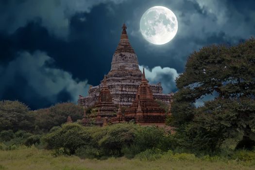 Ancient pagodas in the countryside from Bagan in Myanmar by full moon