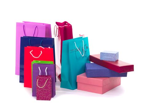 Colourful and bright shopping packages and boxes for gifts and presents isolated on white