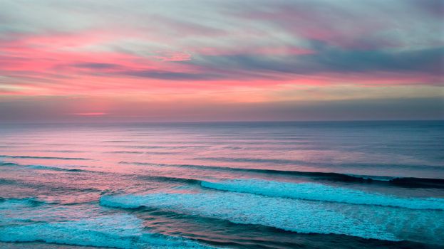 Aerial from a beautiful sunset at Vale Figueiras beach in Portugal