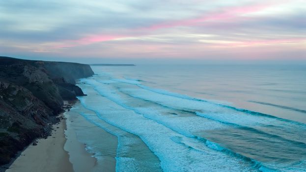 Aerial from a beautiful sunset at Vale Figueiras beach in Portugal