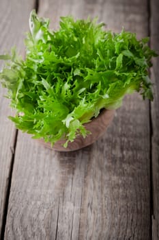Fresh green lettuce on  a wooden table