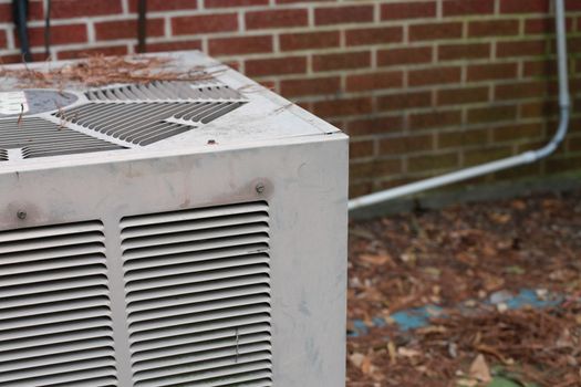 Air conditioning unit outside of red brick building