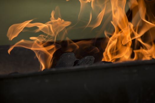 Flaming charcoal in barbecue pit
