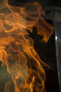 Close-up of flames shooting from grill