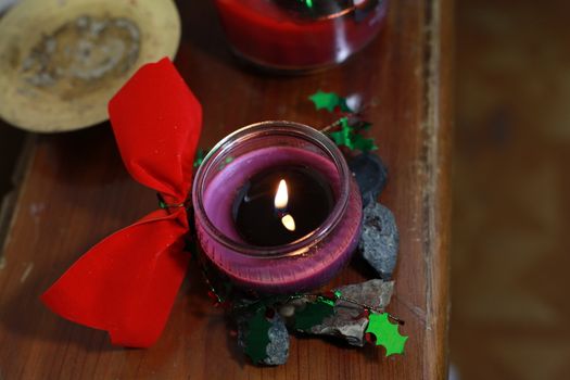 Purple candle and Christmas decorations
