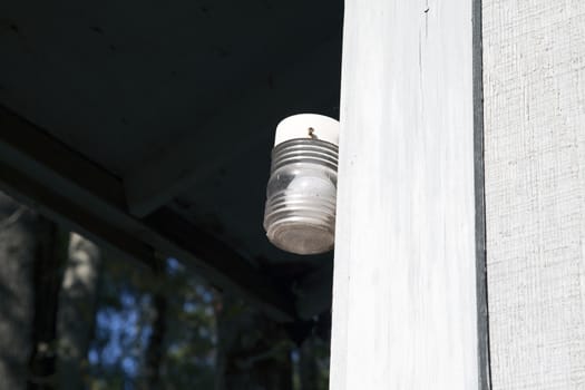 Porch light outside in the daytime