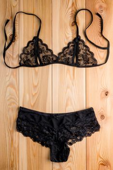 Sets of sexy lace lingerie to seduce on the wooden floor