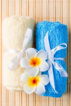 terrycloth towels and exotic flowers for spa treatments closeup