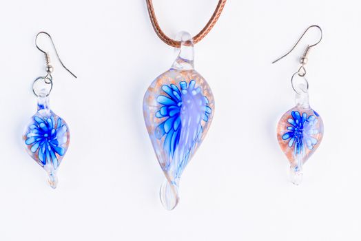 Murano glass jewelry on a white background closeup