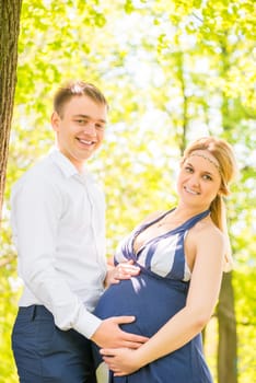 Vertical portrait of happy couple waiting for baby