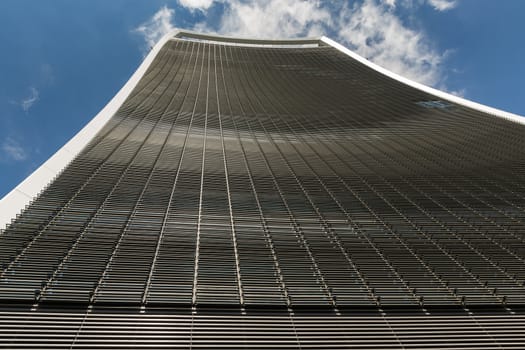 Business and Financial District of London - tall curved building looking straight up