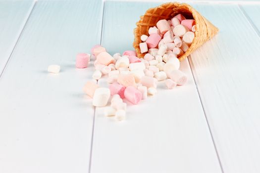 Dessert in ice cream cone on gray background on a white background