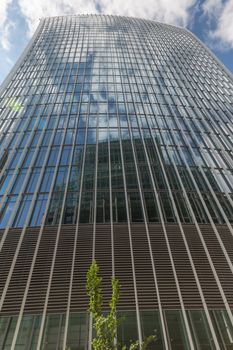 Business and Financial District of London - a tall curved building from below