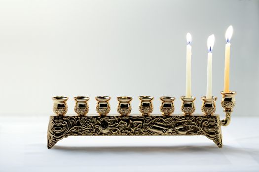 The Symbols of Hanukkah - nine-branched mehorah Hanukiah