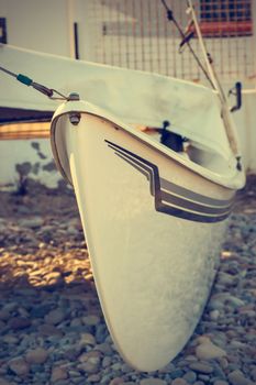 Detail of a catamaran on the beach. Vertical image.