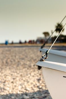 Catamaran detail close up on the beach. Vertical image.