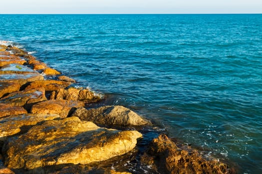 Stones of the sea breakwater. Horizontal image.