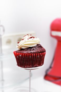 Red velvet cupcake on a professional bakery. Vertical image.