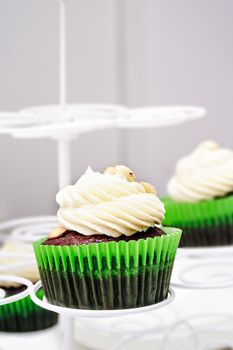 Chocolate and hazelnut cream cupcake on a professional bakery. Vertical image.