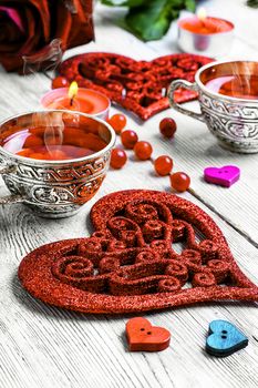 couple cups of tea and symbolic heart for Valentine's day