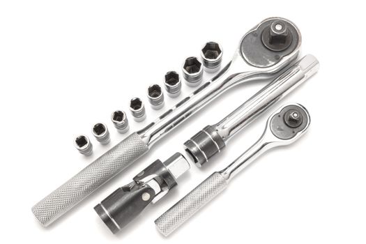 Ratchet spanner and sockets on technical draw background