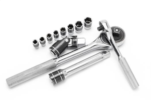 Ratchet spanner and sockets on technical draw background