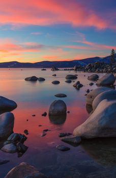 The northern part of Lake Tahoe straddles the border between Calfiornia and Nevada. It's dominant features are big glaciated boulders and clear blue waters.
