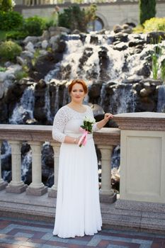 Bride big body on the wedding day for a walk