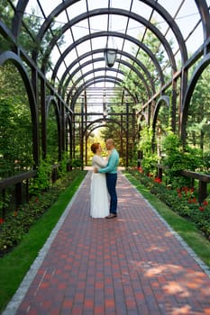 wedding copule. Beautiful bride and groom. Just merried. Close up. Happy bride and groom on their wedding hugging.