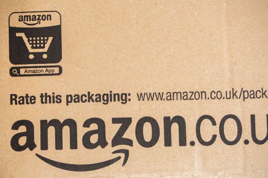 Paris, France - December 15, 2016: Amazon Prime Parcel Package. Amazon, is an American electronic commerce and cloud computing company,based in Seattle, Washington. Started as an online bookstore, Amazon is become the most importrant retailer in the United States by market capitalization