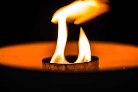 A candle flickering in the dark