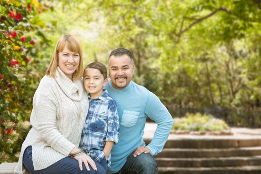 Happy Mixed Race Hispanic and Caucasian Family Portrait at the Park.
