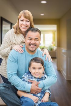 Happy Mixed Race Family Portrait Inside Their New House.