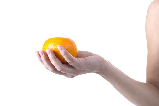 Orange ripe mandarin in the hands of a young woman