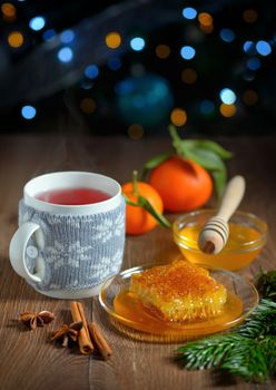cup of hot tea with honey and winter spices