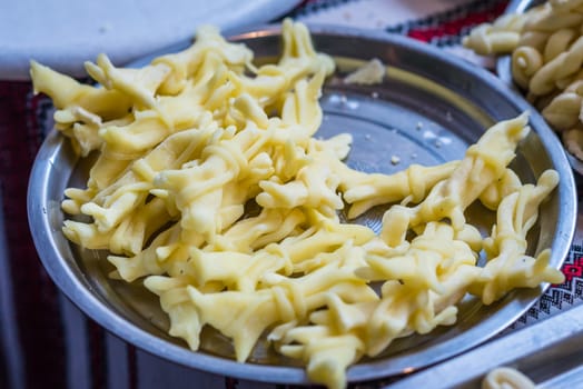 braided white cheese on a plate for sale