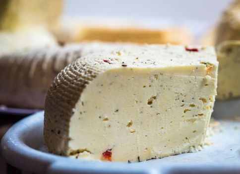 piece of delicious white cheese with spices