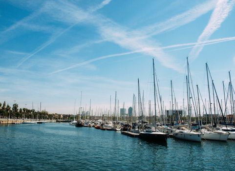 Spain. Barcelona. Yacht club at sunset. A lot of masts