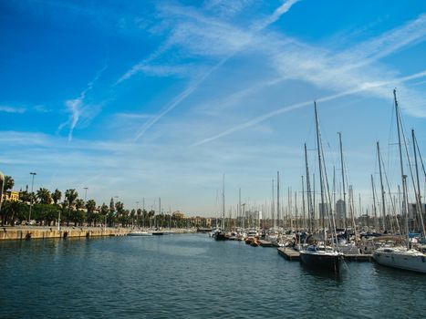 Spain. Barcelona. Yacht club at sunset. A lot of masts