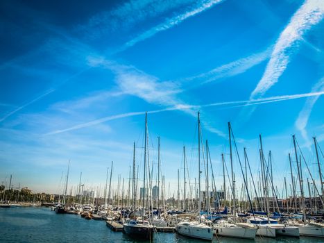 Spain. Barcelona. Yacht club at sunset. A lot of masts