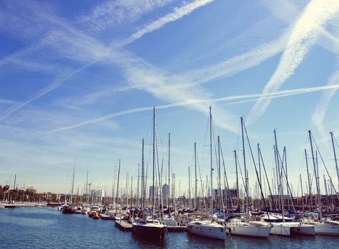 Spain. Barcelona. Yacht club at sunset. A lot of masts