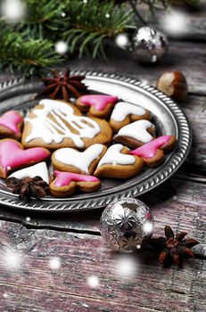 Homemade Christmas cookies in the shape of hearts on saucer