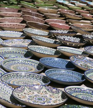 Traditional ceramic dishware in a street market, Uzbekistan