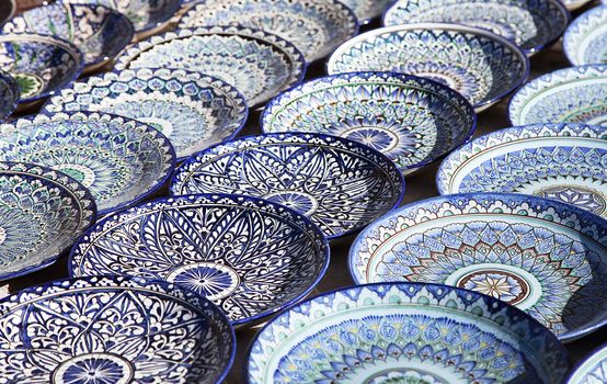 Traditional ceramic dishware in a street market, Uzbekistan