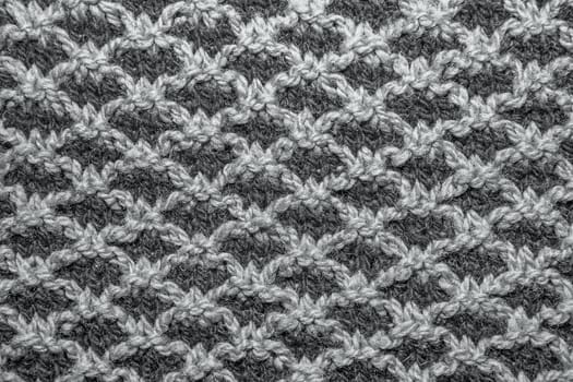 Brown knitted cloth is made by hand. It is decorated with pineapple bulging pattern.
