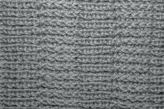 Wool hand-knitted Pattern. Closeup Fabric Background