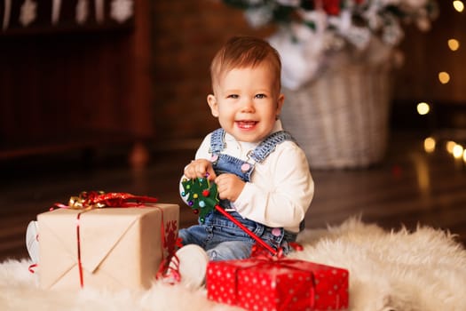 Portrait of cute little baby girl among Christmas decorations