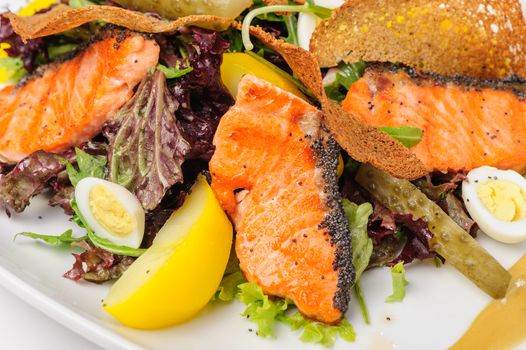 Caesar salad with grilled salmon and quail eggs